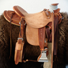 Half Breed Vaquero Wade Saddle by Keith Valley   Specs: Wade tree by Rick Reed 15 & 1/2 inch seat, Gullet - 7 & 1/2H X 6 & 1/4W X 4, 93 Degree Bars, Horn - 3 & 5/8ths high X 4 & 1/2 Guatelajara, Cantle - 4&1/2 inches high X 12&1/2 inches wide, Cheyenne Roll - 1 & 3/4 inches, 7/8ths flat plate riggin.  Sporting Keith's Vaquero Border with Sheridan Floral tooling within, Stainless Steel Hardware - by Harwood, 4 inch Monel Stirrups, Santa Barbara twisted for easy handling, Vaquero outside stirrup leathers, 100% handmade Mohair Roper Cinch, Hand cut 7 foot latigos for both sides.  Made for a special order - **SOLD** but we take orders.